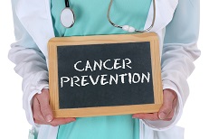 MD holding cancer prevention sign